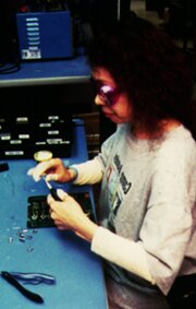 High-volume electronic assembly by a worker